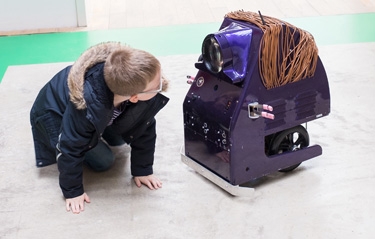 image of child with robot